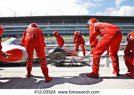 Racing team working at pit stop View Large Photo Image Picture - Racing team working at pit stop. Fotosearch