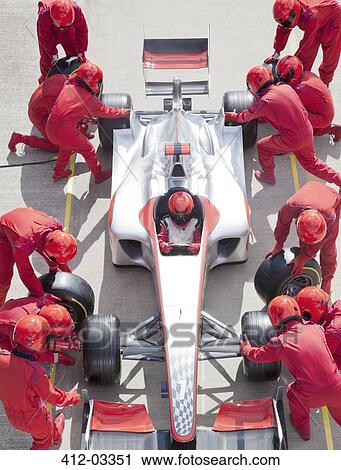 Racing team working at pit stop View Large Photo Image Stock Image - Racing team working at pit stop. Fotosearch