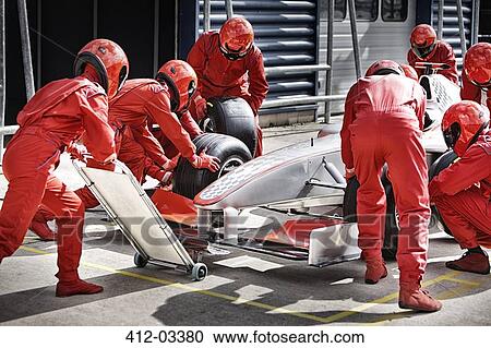 Racing team working at pit stop View Large Photo Image Stock Image - Racing team working at pit stop. Fotosearch