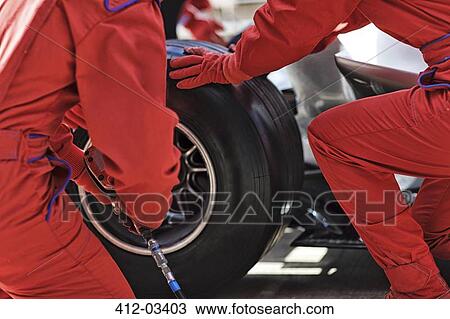 Racing team working at pit stop View Large Photo Image Stock Image - Racing team working at pit stop. Fotosearch