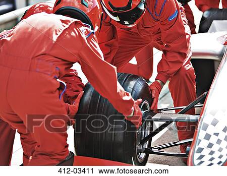 Racing team working at pit stop View Large Photo Image Stock Image - Racing team working at pit stop. Fotosearch