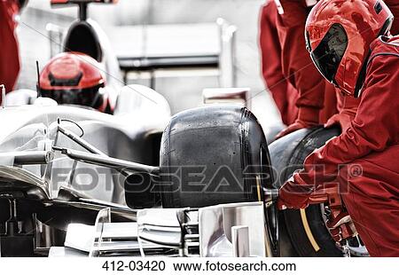 Racing team working at pit stop View Large Photo Image Stock Image - Racing team working at pit stop. Fotosearch