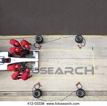 Racing team working at pit stop View Large Photo Image Stock Photo - Racing team working at pit stop. Fotosearch