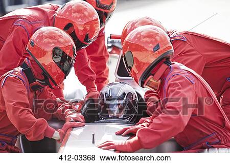 Racing team working at pit stop View Large Photo Image Stock Photo - Racing team working at pit stop. Fotosearch