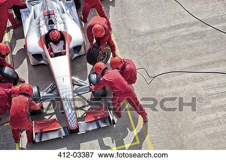 Racing team working at pit stop View Large Photo Image Stock Photo - Racing team working at pit stop. Fotosearch