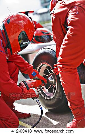 Racing team working at pit stop View Large Photo Image Stock Photo - Racing team working at pit stop. Fotosearch