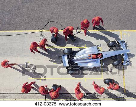 Racing team working at pit stop View Large Photo Image Stock Photography - Racing team working at pit stop. Fotosearch