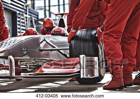 Racing team working at pit stop View Large Photo Image Stock Photography - Racing team working at pit stop. Fotosearch