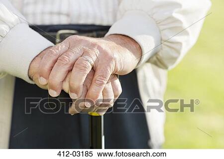 Close up of older man's hands on cane View Large Photo Image Stock Photography - Close up of older man's hands on cane. Fotosearch