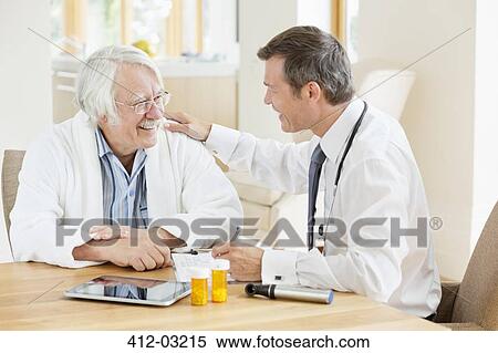 Doctor talking to older patient at house call View Large Photo Image Stock Photography - Doctor talking to older patient at house call. Fotosearch