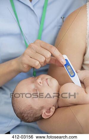 Nurse taking baby's temperature View Large Photo Image Stock Photograph - Nurse taking baby's temperature. Fotosearch