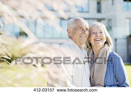 Stock Photo - Older couple smiling outdoors. Fotosearch