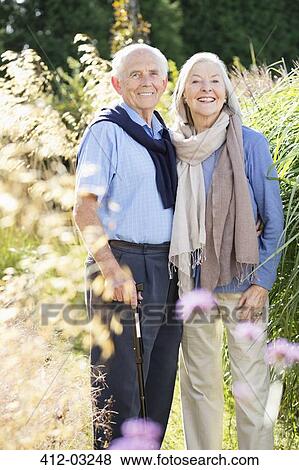 Older couple standing together outdoors View Large Photo Image Stock Photo - Older couple standing together outdoors. Fotosearch