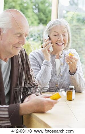 Older couple taking medication View Large Photo Image Stock Photo - Older couple taking medication. Fotosearch