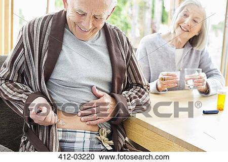 Older man giving himself injection View Large Photo Image Stock Image - Older man giving himself injection. Fotosearch
