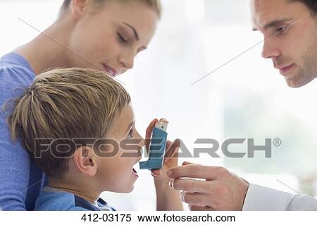 Parents giving son asthma inhaler View Large Photo Image Stock Photography - Parents giving son asthma inhaler. Fotosearch