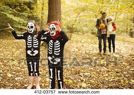 Children in skeleton costumes walking in park View Large Photo Image Stock Photo - Children in skeleton costumes walking in park. Fotosearch