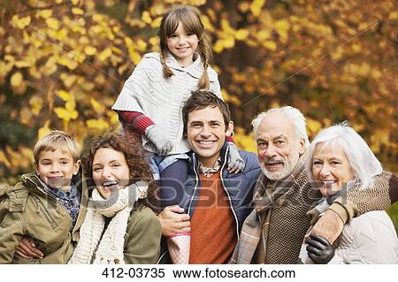 Family smiling together in park View Large Photo Image Stock Photography - Family smiling together in park. Fotosearch