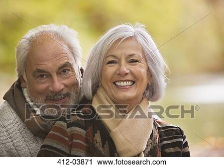 Older couple hugging in park View Large Photo Image Stock Image - Older couple hugging in park. Fotosearch
