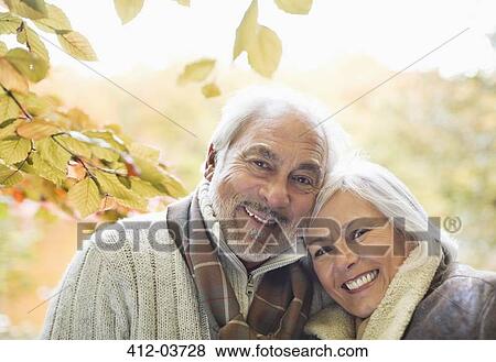 Stock Photo - Older couple smiling in park. Fotosearch