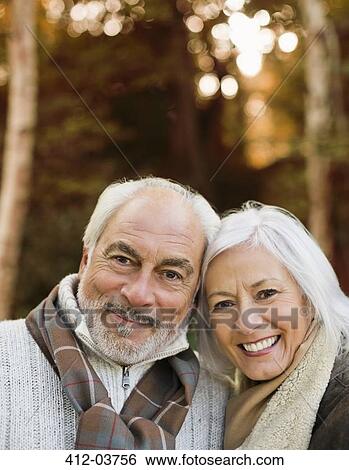 Older couple smiling together in park View Large Photo Image Stock Photograph - Older couple smiling together in park. Fotosearch