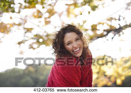 Smiling woman standing outdoors View Large Photo Image Stock Photography - Smiling woman standing outdoors. Fotosearch