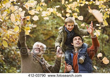 Three generations of men examining leaves View Large Photo Image Stock Image - Three generations of men examining leaves. Fotosearch