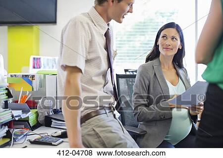 Business people talking in office View Large Photo Image Stock Photo - Business people talking in office. Fotosearch