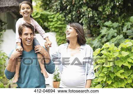 Picture - Family walking together outdoors. Fotosearch