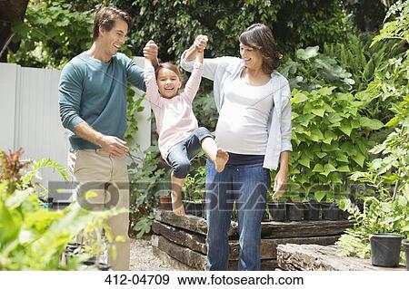 Family walking together outdoors View Large Photo Image Stock Photo - Family walking together outdoors. Fotosearch