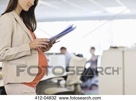 Pregnant businesswoman working in office View Large Photo Image Stock Image - Pregnant businesswoman working in office. Fotosearch