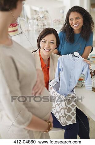 Pregnant woman having baby shower View Large Photo Image Stock Image - Pregnant woman having baby shower. Fotosearch