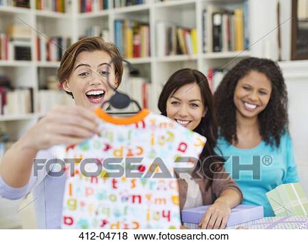 Stock Photo - Pregnant woman having baby shower. Fotosearch