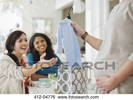 Pregnant woman having baby shower View Large Photo Image Stock Photograph - Pregnant woman having baby shower. Fotosearch