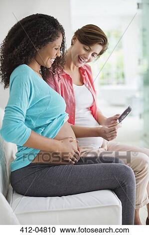 Pregnant women examining sonogram View Large Photo Image Stock Image - Pregnant women examining sonogram. Fotosearch