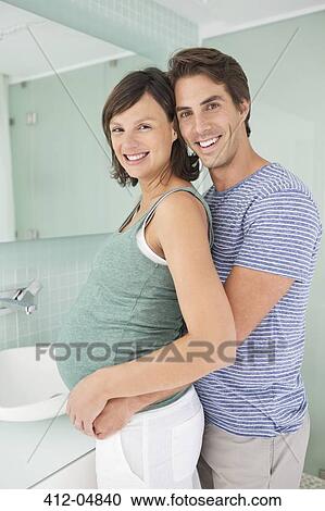 Smiling couple hugging in bathroom View Large Photo Image Stock Image - Smiling couple hugging in bathroom. Fotosearch
