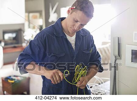 Electrician cutting wires in home View Large Photo Image Picture - Electrician cutting wires in home. Fotosearch