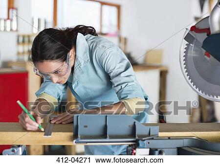 Woman working in workshop View Large Photo Image Stock Image - Woman working in workshop. Fotosearch