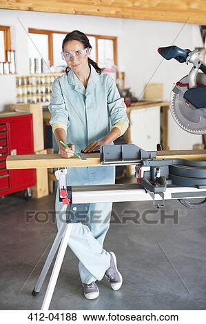 Woman working in workshop View Large Photo Image Stock Photo - Woman working in workshop. Fotosearch