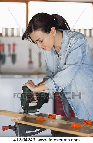 Woman working in workshop View Large Photo Image Stock Photo - Woman working in workshop. Fotosearch