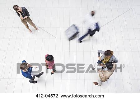 Business people in busy office hallway View Large Photo Image Stock Image - Business people in busy office hallway. Fotosearch