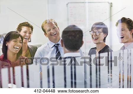 Stock Photo - Business people laughing in meeting. Fotosearch