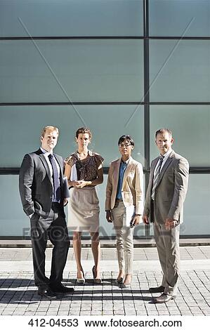 Business people smiling on city street View Large Photo Image Stock Image - Business people smiling on city street. Fotosearch