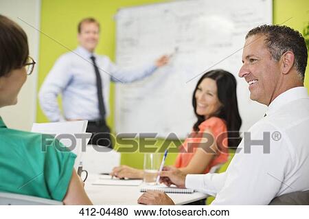 Business people talking in meeting View Large Photo Image Stock Image - Business people talking in meeting. Fotosearch