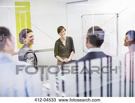 Business people talking in meeting View Large Photo Image Stock Image - Business people talking in meeting. Fotosearch