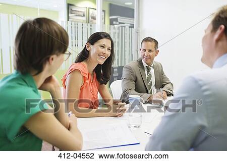 Business people talking in meeting View Large Photo Image Stock Image - Business people talking in meeting. Fotosearch