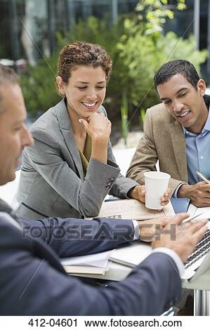 Business people talking in meeting outdoors View Large Photo Image Stock Image - Business people talking in meeting outdoors. Fotosearch