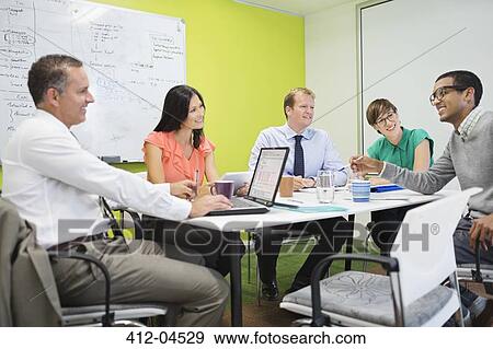 Business people talking in meeting View Large Photo Image Stock Photo - Business people talking in meeting. Fotosearch