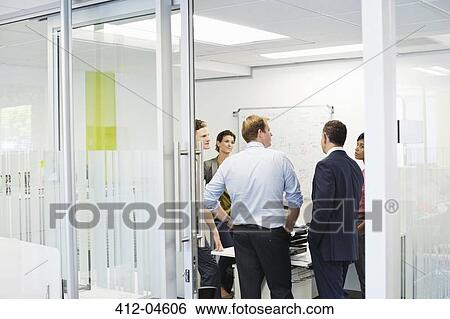 Business people talking in meeting View Large Photo Image Stock Photograph - Business people talking in meeting. Fotosearch