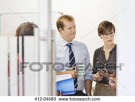 Business people talking in office View Large Photo Image Stock Image - Business people talking in office. Fotosearch